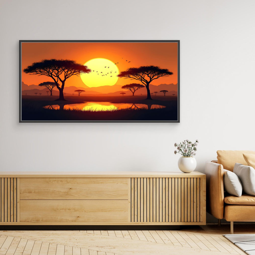 Acacia Trees canvas wall art featuring a vibrant orange sunset with silhouetted acacia trees and distant mountains in a modern black frame