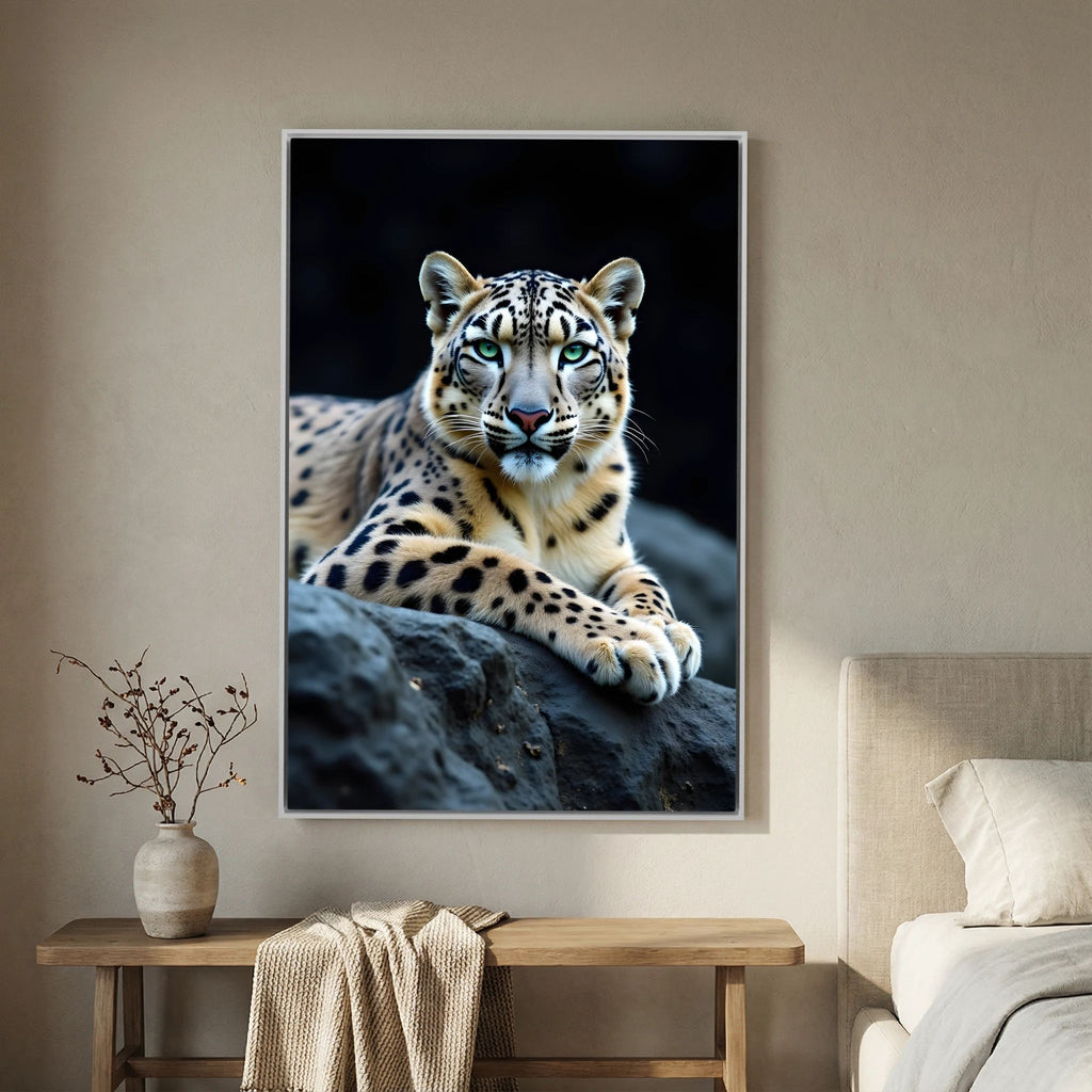 Snow Leopard Big Cat Canvas featuring a lifelike snow leopard with green eyes resting on dark rocks, detailed fur and realistic pattern